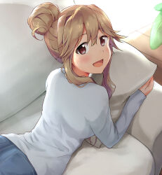 Rule 34 | 1girl, :d, brown eyes, brown hair, couch, denim, flipped hair, from above, grey shirt, hair between eyes, hair bun, hugging object, idolmaster, idolmaster million live!, indoors, jeans, light blush, long sleeves, looking at viewer, looking back, lying, on couch, on stomach, open mouth, pants, pillow, pillow hug, shirt, short hair with long locks, shuucream (syuichi), sidelocks, smile, solo, sunlight, tenkuubashi tomoka, upper body