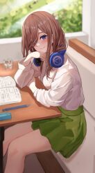 Rule 34 | 1girl, absurdres, blue eyes, blush, book, brown hair, cafe, closed mouth, commentary request, day, dress shirt, elbows on table, eyebrows hidden by hair, eyelashes, feet out of frame, glass, go-toubun no hanayome, green skirt, hair between eyes, hair over one eye, hand on own chin, hand up, head tilt, headphones, headphones around neck, highres, indoors, long hair, long sleeves, looking at viewer, miniskirt, nakano miku, open book, pen, pleated skirt, raikun raikun, school uniform, shirt, sitting, skirt, smile, solo, white shirt