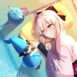 1girl ahoge black_bow blonde_hair bow character_doll cimeri fate/grand_order fate_(series) fujimaru_ritsuka_(male) hair_between_eyes hair_bow japanese_clothes kimono lying merry_christmas obi okita_souji_(fate) okita_souji_(koha-ace) on_side pillow pink_kimono sash short_hair smile wide_sleeves yellow_eyes