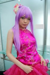 Rule 34 | 1girl, asian, bare shoulders, breasts, character request, china dress, chinese clothes, copyright request, cosplay, dress, eyeliner, flower, frills, glass wall, hair flower, hair ornament, highres, indoors, long hair, looking at viewer, makeup, mole, namada, photo (medium), pink dress, purple hair, real life, small breasts, solo, standing, upper body