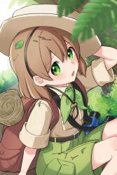 1boy :o absurdres amakusa_setoka backpack bag belt belt_buckle binoculars blush breast_pocket brown_bag brown_belt brown_hair buckle budding_expeditioner_(pokemon) commentary_request creatures_(company) day game_freak green_eyes green_shorts hat highres leaf looking_at_viewer male_focus nintendo open_mouth outdoors pocket pokemon pokemon_tcg pokemon_tcg_pocket scroll shirt short_sleeves shorts sitting solo