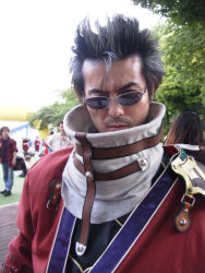 Rule 34 | 1boy, armor, asian, auron, auron (cosplay), beard, black eyes, black hair, closed mouth, coat, cosplay, cosplay photo, day, facial hair, final fantasy, final fantasy x, glasses, lips, looking at viewer, male focus, one eye closed, photo (medium), red coat, scar, scar across, shoulder pads, solo focus, thick eyebrows, tree, upper body