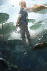 Rule 34 | 1boy, black gloves, blonde hair, blurry, blurry foreground, boots, brown footwear, bubble, ear piercing, fingerless gloves, from behind, gloves, highres, holding, holding sword, holding weapon, jewelry, lily pad, link, long sleeves, low ponytail, mada (shizhou), male focus, master sword, nintendo, outdoors, piercing, pointy ears, ponytail, solo, standing, sword, the legend of zelda, the legend of zelda: breath of the wild, tunic, water, weapon