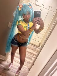 1girl brazilian_miku brazilian_miku_(cosplay) cellphone cosplay dark-skinned_female dark_skin hatsune_miku highres jeans_shorts legs long_hair phone real_life selfie shorts solo