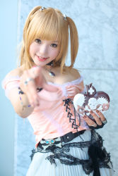 Rule 34 | 1girl, amane misa, amane misa (cosplay), asian, bare shoulders, blonde hair, breasts, choker, color contacts, cosplay, cross, death note, fingerless gloves, gloves, hair ornament, highres, indoors, jewelry, kipi-san, long hair, looking at viewer, miniskirt, mole, pendant, photo (medium), pointing, pointing at viewer, ring, single glove, skirt, skull and crossbones, skull hair ornament, skull ring, small breasts, smile, solo, two side up
