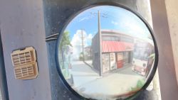 Rule 34 | banishment, blue sky, blurry, blurry foreground, bus, cloud, day, fisheye, highres, motor vehicle, no humans, original, outdoors, power lines, reflection, road, scenery, sky, street, summer, traffic mirror, tree, utility pole, vending machine