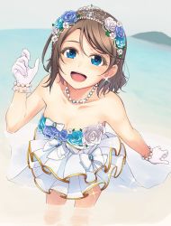 Rule 34 | 1girl, :d, bare shoulders, beach, blue eyes, blue flower, bow, bracelet, breasts, brown hair, cleavage, clenched hands, collarbone, commentary request, day, dress, earrings, flower, gloves, hair flower, hair ornament, highres, jewelry, leaning forward, looking at viewer, love live!, love live! school idol festival, love live! sunshine!!, medium breasts, nanotsuki, necklace, open mouth, outdoors, pearl bracelet, pearl necklace, short hair, smile, solo, sparkle, standing, strapless, strapless dress, tiara, wading, waist cape, watanabe you, white bow, white dress, white flower, white gloves