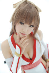 Rule 34 | 1girl, asian, breasts, brown eyes, brown hair, cleavage, cosplay, dead or alive, highres, indoors, kasumi (doa), kasumi (doa) (cosplay), kipi-san, long hair, looking at viewer, mole, photo (medium), simple background, small breasts, solo, tagme, white background