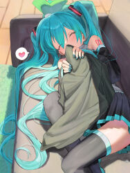 1girl aqua_hair aqua_nails bare_shoulders black_skirt blush closed_eyes couch covering_own_mouth detached_sleeves grey_shirt hair_ornament hatsune_miku headset highres holding indoors kanimiso_uni long_hair number_tattoo on_couch pillow shirt skirt solo spring_onion tattoo thighhighs twintails very_long_hair vocaloid