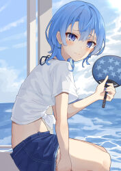 1girl absurdres beach bikini bikini_under_clothes blue_eyes blue_hair blue_nails denim denim_shorts earrings hand_fan highres hololive hoshimachi_suisei jewelry kisara_mikami looking_at_viewer looking_to_the_side midriff nail_polish paper_fan shirt short_hair shorts sitting smile solo swimsuit tied_shirt virtual_youtuber water white_shirt