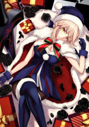 Rule 34 | 1girl, artoria pendragon (all), artoria pendragon (fate), augu (523764197), black flower, black pantyhose, blonde hair, blue dress, blue footwear, blue gloves, blue santa costume, boots, box, breasts, cape, cleavage, crossed legs, dress, fate/grand order, fate (series), flower, from above, fur trim, gift, gift box, gloves, hat, head tilt, large breasts, lying, on back, pantyhose, pleated dress, santa alter, santa costume, santa hat, short dress, sidelocks, solo, strapless, strapless dress, thigh boots, thighhighs, yellow eyes