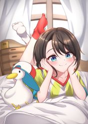 Rule 34 | 1girl, 1other, asymmetrical legwear, bed sheet, blue eyes, blush, breasts, brown hair, closed mouth, collarbone, crossed legs, curtains, feet, feet up, full body, hashira 14, highres, hololive, indoors, lying, medium hair, mismatched legwear, no shoes, on stomach, oozora subaru, oozora subaru (1st costume), red socks, shirt, short sleeves, shorts, smile, socks, soles, striped clothes, striped shirt, subaru duck, swept bangs, t-shirt, the pose, toes, vertical-striped clothes, vertical-striped shirt, virtual youtuber, white shirt, white socks, window, yellow shirt, yellow shorts