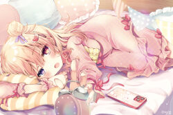 1girl artist_name bed_sheet blonde_hair blurry blurry_foreground blush bow capri_pants cellphone center_frills clock frilled_pants frilled_pillow frills hair_bun hair_ornament hair_ribbon hairclip heart heart_hair_ornament heterochromia highres indoors kasane_(cynthia) long_sleeves looking_at_viewer lying medium_hair on_bed on_side open_mouth original outstretched_hand pajamas pants phone pillow pink_pajamas pink_pants pink_scrunchie pink_shirt plaid_clothes plaid_pajamas purple_eyes purple_ribbon reaching reaching_towards_viewer red_bow red_eyes ribbon scrunchie shirt signature smartphone solo wrist_scrunchie