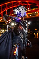 Rule 34 | 1boy, armor, black cape, blue eyes, cape, cosplay, cosplay photo, fate/grand order, fate (series), gloves, glowing, glowing eyes, glowing hand, grey gloves, helmet, highres, looking at viewer, male focus, odysseus (fate), odysseus (fate) (cosplay), open hand, photo (medium), power armor, rev (rev006010), solo