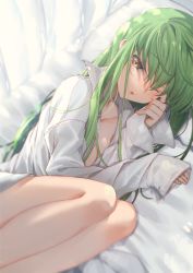 Rule 34 | 1girl, bed sheet, breasts, c.c., cleavage, code geass, commentary request, creayus, green hair, legs, long hair, long sleeves, looking at viewer, lying, naked shirt, on side, one eye closed, open clothes, open shirt, pillow, shirt, small breasts, solo, white shirt, yellow eyes