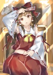 Rule 34 | 1girl, arm above head, armpits, ascot, bad id, bad pixiv id, between fingers, bow, box, brown hair, detached sleeves, donation box, hair bow, hair tubes, hakurei reimu, head tilt, highres, holding, light rays, long hair, looking at viewer, midriff, navel, ofuda, parted lips, qwyte, red eyes, ribbon-trimmed sleeves, ribbon trim, sitting, skirt, skirt set, solo, sunbeam, sunlight, touhou