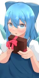 1girl :o blue_bow blue_dress blue_eyes blue_hair blush bow box cirno commentary_request dot_nose double-parted_bangs dress eyes_visible_through_hair gift hair_between_eyes hair_bow hands_up heart heart_in_eye highres holding holding_box holding_gift ice ice_wings looking_at_viewer medium_hair mizune_(winter) open_mouth short_sleeves simple_background solo symbol_in_eye touhou upper_body upturned_eyes valentine white_background wings