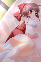 1girl alfred_(artist) ass bed dress female_focus hakurei_reimu highres pillow solo touhou