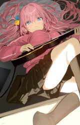 1girl black_skirt black_socks blue_eyes bocchi_the_rock! breasts commentary_request cube_hair_ornament electric_guitar gibson_les_paul gotoh_hitori guitar hair_between_eyes hair_ornament haruri highres holding holding_guitar holding_instrument instrument jacket large_breasts long_sleeves looking_at_viewer lying on_back pink_hair pink_jacket skirt socks solo thighs