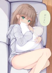 Rule 34 | 1girl, absurdres, blush, bottomless, brown hair, couch, covered mouth, green eyes, highres, hood, hoodie, long sleeves, lying, hugging object, on couch, on side, original, pillow, pillow hug, sashima, solo, translated, wooden floor