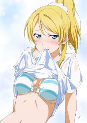 Rule 34 | 1girl, ayase eli, bikini, blonde hair, blue bikini, blue eyes, blush, breasts, clothes lift, highres, large breasts, lifted by self, long hair, looking at viewer, love live!, love live! school idol project, mouth hold, nagi mkrnpn, navel, ponytail, shirt, shirt lift, short sleeves, solo, stomach, swimsuit, wet, wet clothes, wet shirt, white shirt