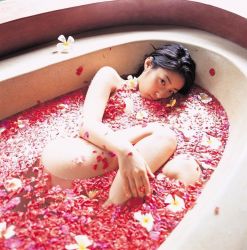 Rule 34 | 1girl, asian, bath, bathtub, black hair, flower, hiroko sato, japanese (nationality), long hair, lying, nude, petals, photo (medium), thighs, water, wet
