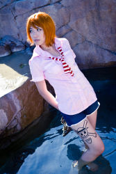 Rule 34 | 1girl, arms behind back, collared shirt, cosplay, female focus, highres, holding, joluffirosauce, looking to the side, nami (one piece), nami (one piece) (cosplay), no shoes, one piece, photo (medium), pink shirt, shirt, shoes, short hair, short sleeves, shorts, solo, toes, unworn shoes, wading, water