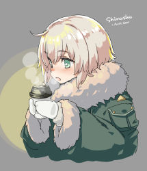 Rule 34 | 1girl, aka ringo, blonde hair, blush, character name, drink, fur-trimmed jacket, fur trim, gloves, green eyes, green jacket, grey background, hair between eyes, highres, holding, holding drink, jacket, kantai collection, long sleeves, open mouth, shimushu (kancolle), short hair, simple background, solo, white gloves