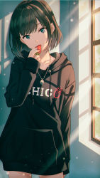 Rule 34 | 1girl, black hair, black hoodie, blue eyes, clothes writing, collarbone, cowboy shot, drawstring, food, fruit, hand up, head tilt, highres, holding, holding food, holding fruit, hood, hood down, hoodie, hyuuga azuri, jewelry, light rays, long hoodie, long sleeves, looking at viewer, necklace, open mouth, original, short hair, solo, standing, strawberry, window, window shadow