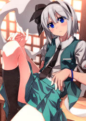 Rule 34 | 1girl, backlighting, black hairband, black necktie, black ribbon, black socks, blue eyes, blush, closed mouth, collared shirt, commentary request, expressionless, feet out of frame, flat chest, green skirt, green vest, hair between eyes, hair ribbon, hairband, hand up, highres, index finger raised, indoors, knee up, kneehighs, konpaku youmu, konpaku youmu (ghost), leaning back, looking at viewer, necktie, open clothes, open vest, pleated skirt, puffy short sleeves, puffy sleeves, ribbon, sazanami mio, shirt, short hair, short sleeves, silver hair, sitting, skirt, skirt set, socks, solo, sweat, touhou, vest, white shirt, window, wing collar