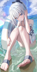 Rule 34 | 1girl, absurdres, bare arms, bare shoulders, blue archive, blue halo, blush, day, frilled one-piece swimsuit, frills, grey hair, guree (haiiro), halo, highres, innertube, long hair, looking at viewer, miyako (blue archive), miyako (swimsuit) (blue archive), ocean, off-shoulder one-piece swimsuit, off shoulder, official alternate costume, one-piece swimsuit, outdoors, parted lips, ponytail, purple eyes, sandals, solo, swim ring, swimsuit, toes, water