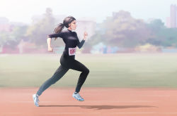 Rule 34 | 1girl, black hair, black pants, blue eyes, blue sky, blurry, breasts, day, depth of field, from side, full body, long hair, long sleeves, medium breasts, original, outdoors, pants, ponytail, profile, running, running track, shadow, shoes, sky, sneakers, solo, track and field, track pants, ttc, white footwear