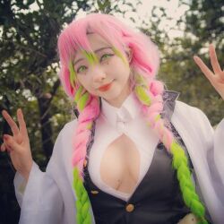 Rule 34 | 1girl, blurry, blurry background, breasts, cleavage, cosplay, demon slayer uniform, double v, female focus, green eyes, green hair, kanroji mitsuri, kanroji mitsuri (cosplay), kimetsu no yaiba, large breasts, long hair, looking at viewer, mexican (nationality), mole, mole on breast, multicolored hair, oz cosplay, photo (medium), pink hair, smile, solo, v