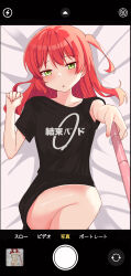 Rule 34 | 1girl, :o, absurdres, ao (flowerclasse), arrow (symbol), bed sheet, black shirt, blush, bocchi the rock!, cellphone display, clothes writing, covering privates, covering chest, feet out of frame, flat chest, green eyes, hair between eyes, half-closed eyes, highres, holding, kita ikuyo, knee up, lightning bolt symbol, long hair, looking at viewer, lying, navel, nude, on back, one side up, parted lips, red hair, selfie, selfie stick, shirt, short sleeves, solo