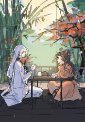 Rule 34 | 2girls, bamboo, blush, brown hair, chinese clothes, chinese commentary, closed eyes, closed mouth, commentary request, cup, cushion, day, du ruo (path to nowhere), earrings, full body, highres, holding, holding cup, jewelry, long hair, multiple girls, on floor, outdoors, parted lips, path to nowhere, pink robe, railing, robe, shutter shades, sitting, smile, table, teacup, teapot, tooong4, tree, white hair, white robe, yao (path to nowhere)