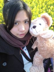 Rule 34 | 1girl, asian, black hair, brown eyes, chouzuki maryou, flower, looking at viewer, mole, photo (medium), plump, ponytail, scarf, solo, stuffed animal, stuffed toy, teddy bear