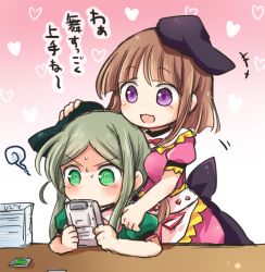 Rule 34 | 2girls, @ @, apron, black hat, blunt bangs, breast press, breasts, brown hair, dress, game boy, game boy (original), gradient background, green dress, green eyes, green hair, hand on another&#039;s head, handheld game console, hat, heart, holding, medium breasts, multiple girls, nishida satono, one-hour drawing challenge, pink background, pink dress, playing games, pote (ptkan), puffy short sleeves, puffy sleeves, purple eyes, short hair with long locks, short sleeves, smile, table, teireida mai, touhou, translated