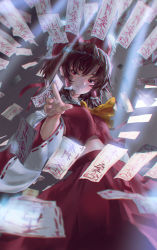 Rule 34 | 1girl, absurdres, arm up, ascot, between fingers, black hair, blurry, blurry background, blurry foreground, bow, commentary request, cowboy shot, hair between eyes, hair bow, hair tubes, hakurei reimu, half-closed eyes, head tilt, highres, holding, light particles, light rays, looking at viewer, midriff, ofuda, ofuda between fingers, outstretched hand, partial commentary, red eyes, red skirt, red vest, shirt, short hair, shuru y, skirt, smile, solo, standing, sunbeam, sunlight, taut clothes, taut shirt, touhou, vest, yellow ascot