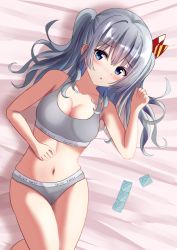 Rule 34 | 1girl, 7shina esprmo, blue eyes, bra, breasts, collarbone, condom, condom packet strip, condom wrapper, grey bra, grey panties, kantai collection, kashima (kancolle), large breasts, lying, navel, on back, panties, sidelocks, silver hair, solo, twintails, underwear, underwear only, wavy hair