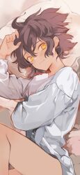 1boy blush bottomless brown_hair check_commentary commentary commentary_request hair_between_eyes hands_up highres kouga_yun long_sleeves looking_at_viewer lying male_focus on_bed on_side original parted_lips pillow shirt short_hair smile solo tan thighs white_shirt yellow_eyes