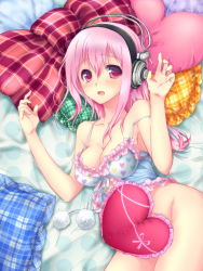 Rule 34 | 1girl, bed sheet, blush, bottomless, breasts, censored, cleavage, convenient censoring, frilled pillow, frills, headphones, heart, heart-shaped pillow, heart print, highres, long hair, lying, medium breasts, nfr, nitroplus, pillow, pink eyes, pink hair, solo, super sonico
