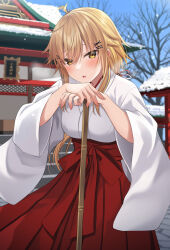 Rule 34 | 1girl, bare tree, blonde hair, blue sky, blush, breasts, breath, brown eyes, building, commentary request, day, hair between eyes, hair ornament, hairclip, hakama, hakama skirt, highres, japanese clothes, kimono, komori kuzuyu, long hair, long sleeves, looking at viewer, medium breasts, miko, nao (kuzuyu), original, outdoors, own hands together, parted lips, red hakama, skirt, sky, snow, snowing, solo, tree, very long hair, white kimono, wide sleeves, x hair ornament