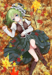 Rule 34 | 1girl, arm ribbon, autumn leaves, bad id, bad pixiv id, blue eyes, boots, buttons, cross-laced footwear, green hair, hat, juliet sleeves, knee boots, leaf, leaf background, light smile, long sleeves, looking at viewer, lying, on back, pleated skirt, puffy sleeves, ribbon, rod of remorse, shiki eiki, shirt, shoulder pads, skirt, smile, solo, touhou, urabe michiru, vest