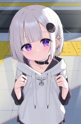 Rule 34 | 1girl, black collar, blush, closed mouth, collar, collarbone, collarbone piercing, commentary request, day, drawstring, ear piercing, earrings, ena (tsukiman), grey hair, hair ornament, hands up, head tilt, highres, holding strap, hood, hood down, hoodie, jewelry, looking at viewer, mole, mole under eye, original, outdoors, piercing, purple eyes, solo, tsukiman, upper body, white hoodie