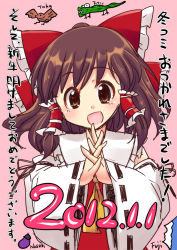 Rule 34 | 1girl, ascot, bare shoulders, bow, brown eyes, brown hair, dated, detached sleeves, hair bow, hair tubes, hakurei reimu, happy new year, new year, open mouth, own hands clasped, own hands together, solo, steepled fingers, touhou, yukari yukke
