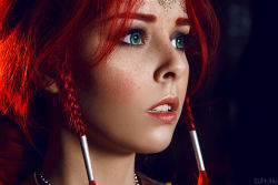 Rule 34 | 1girl, aqua eyes, blue eyes, blurry, braid, center opening, circlet, close-up, cosplay, depth of field, eyeliner, eyeshadow, freckles, green eyes, helly von valentine (disharmonica), indoors, jewelry, looking afar, makeup, necklace, parted lips, photo (medium), red hair, side braids, solo, the witcher (series), triss merigold, triss merigold (cosplay)