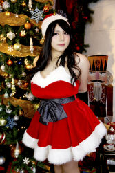 1girl asian black_hair breasts chouzuki_maryou cosplay female_focus hat highres large_breasts photo_(medium) plump santa_costume santa_hat solo