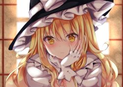 Rule 34 | 1girl, black hat, blonde hair, blush, bow, closed mouth, fingerless gloves, frilled hat, frills, gloves, hand on own face, hat, hat bow, indoors, kirisame marisa, looking at viewer, nanase nao, solo, touhou, upper body, white bow, white gloves, window, witch hat, yellow eyes