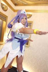 Rule 34 | 1girl, ankle boots, arm up, asian, blue eyes, blue hair, boots, bow, bracelet, breasts, choker, chouzuki maryou, cosplay, cure diamond (cosplay), dokidoki! precure, dress, headpiece, highres, jewelry, large breasts, long hair, magical girl, matching hair/eyes, photo (medium), plump, ponytail, precure, puffy short sleeves, puffy sleeves, ribbon, short sleeves, solo, tiara