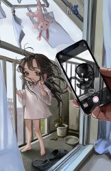 Rule 34 | 1girl, artist name, bad id, bad twitter id, balcony, bare legs, barefoot, broken heart, brown eyes, brown hair, cellphone, child, commentary, curtains, day, english commentary, fetus, floating hair, grin, heart, highres, holding, ishida umi, long hair, looking at viewer, messy hair, original, oversized clothes, oversized shirt, phone, plant, potted plant, pov, pov hands, shirt, short sleeves, slippers, smartphone, smile, solo focus, standing, stuffed animal, stuffed rabbit, stuffed toy, t-shirt, taking picture, v, watermark, white shirt, wind